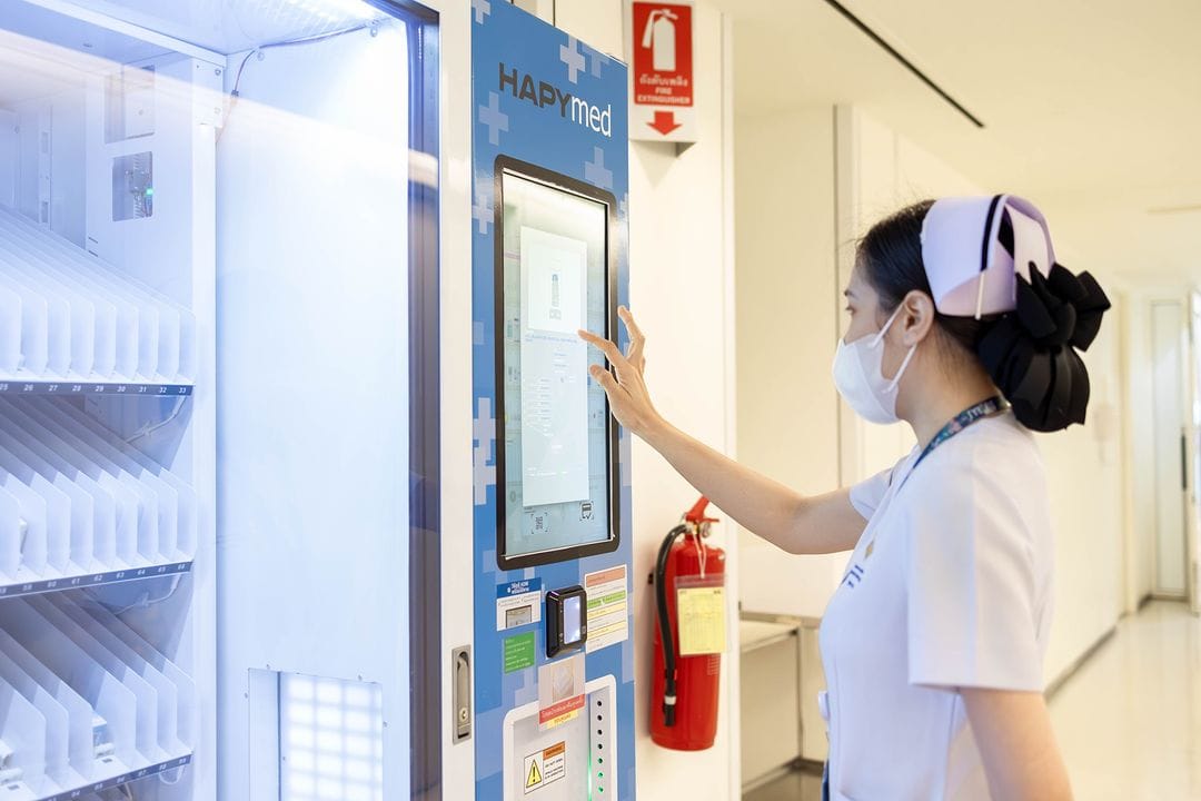 Hospital staff using touchscreen vending machine